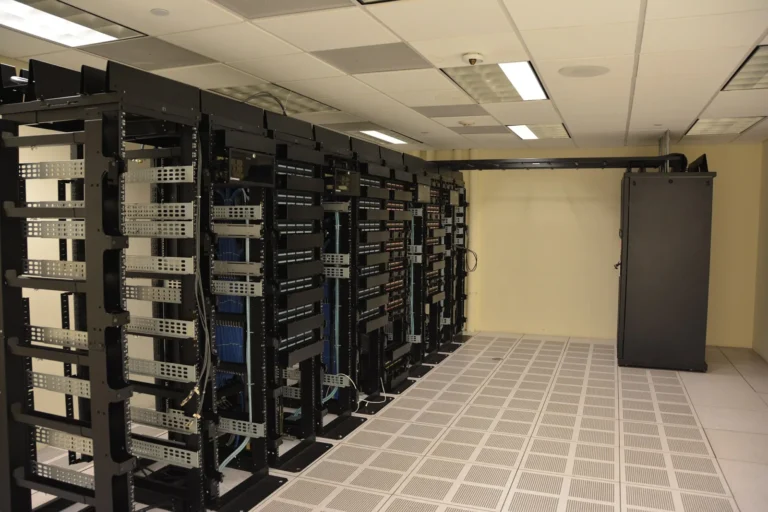 Rows of server racks in a data center hall