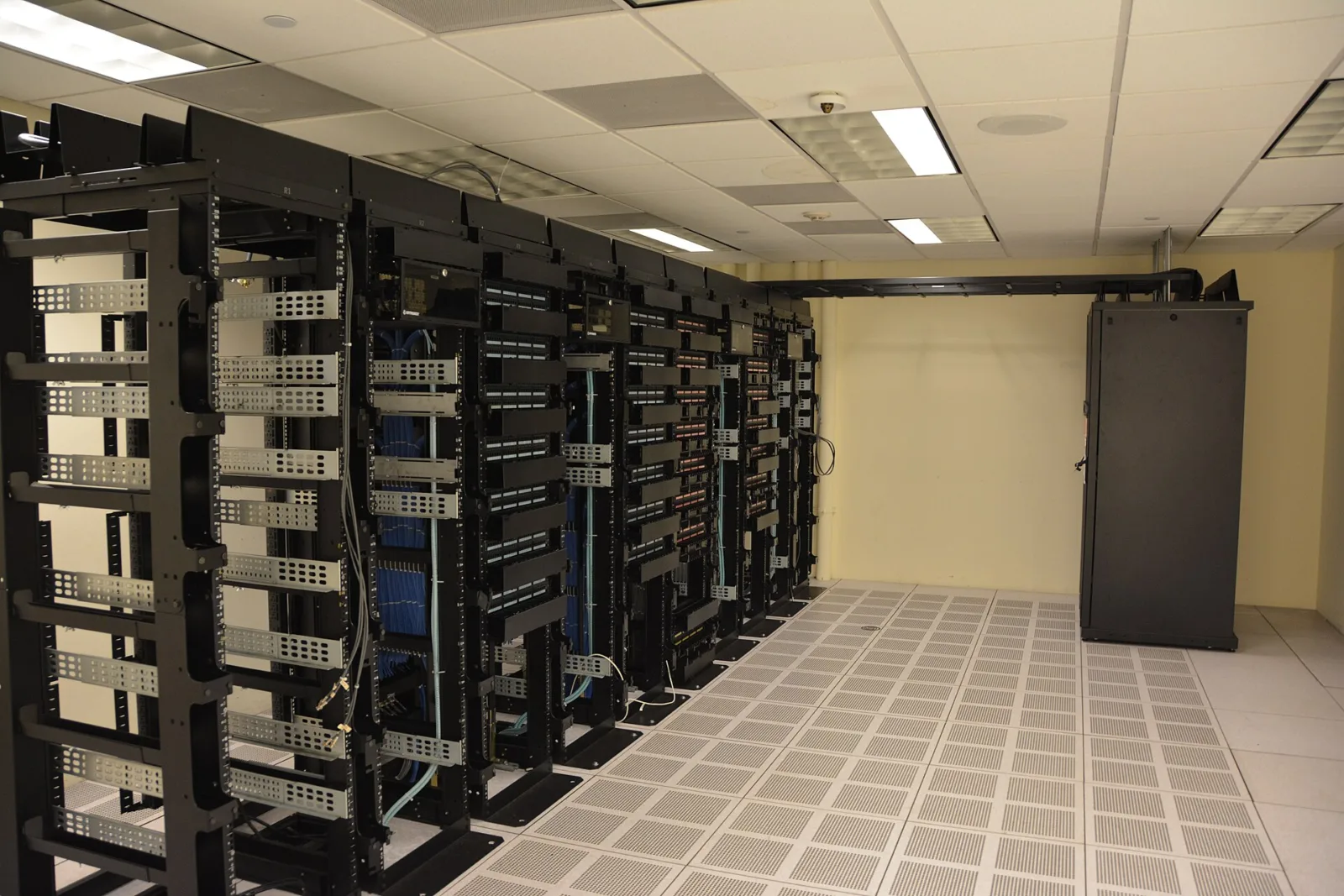 Rows of server racks in a data center hall