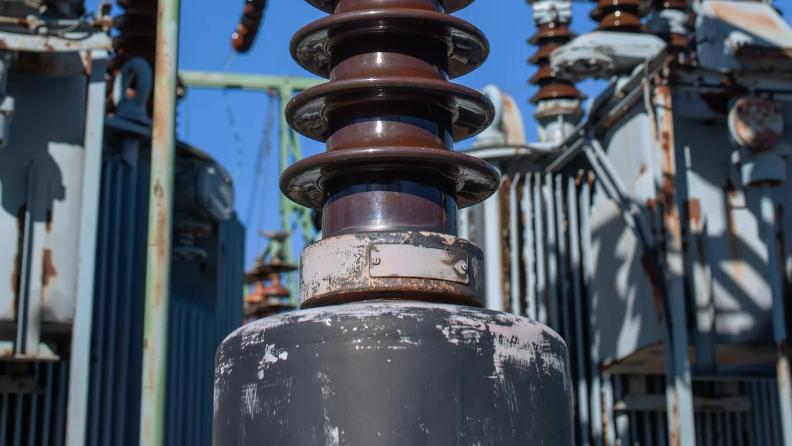 High-voltage instrument transformer with ceramic insulators at an electrical substation in Helsinki, Finland