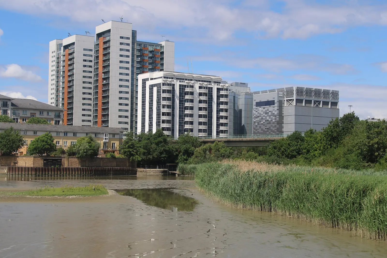 Telehouse West data centre and neighbouring towers seen across the East India Dock Basin in London Docklands